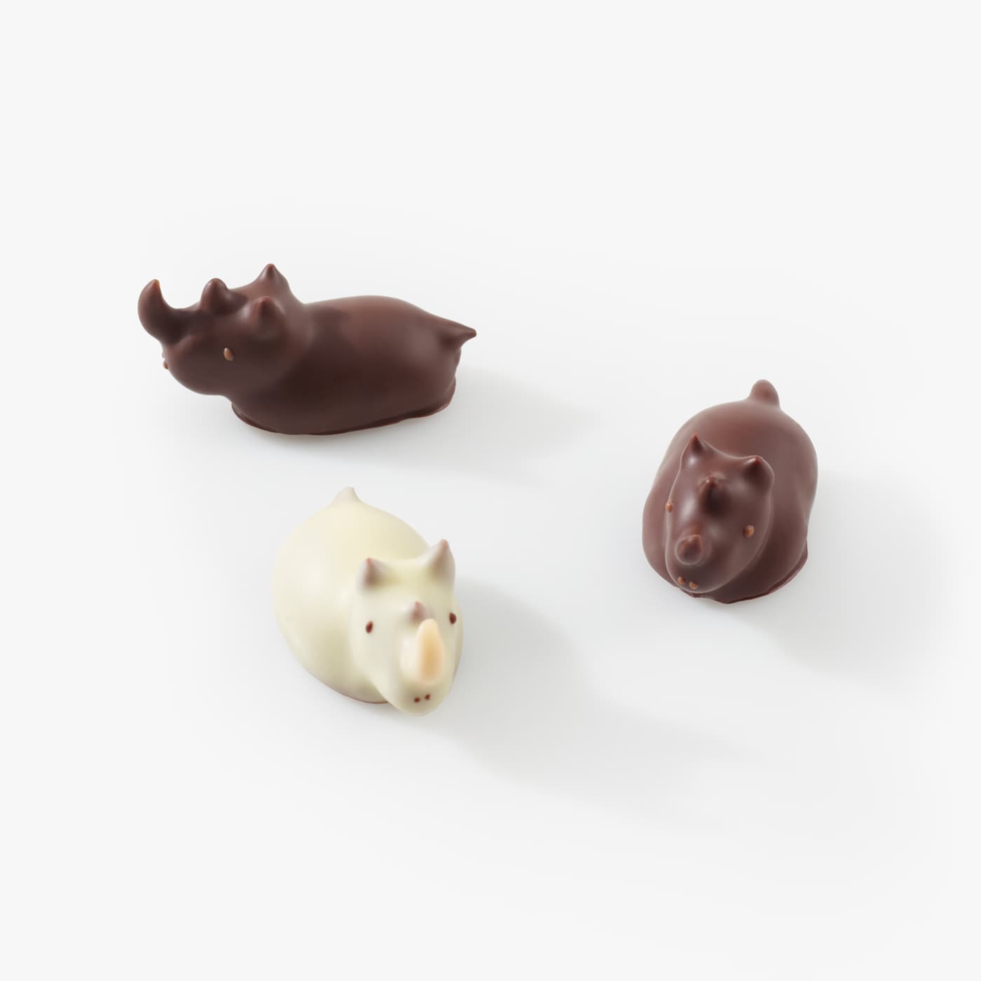 Three of our Chocolate Rhinos, two dark chocolate and one white chocolate.
